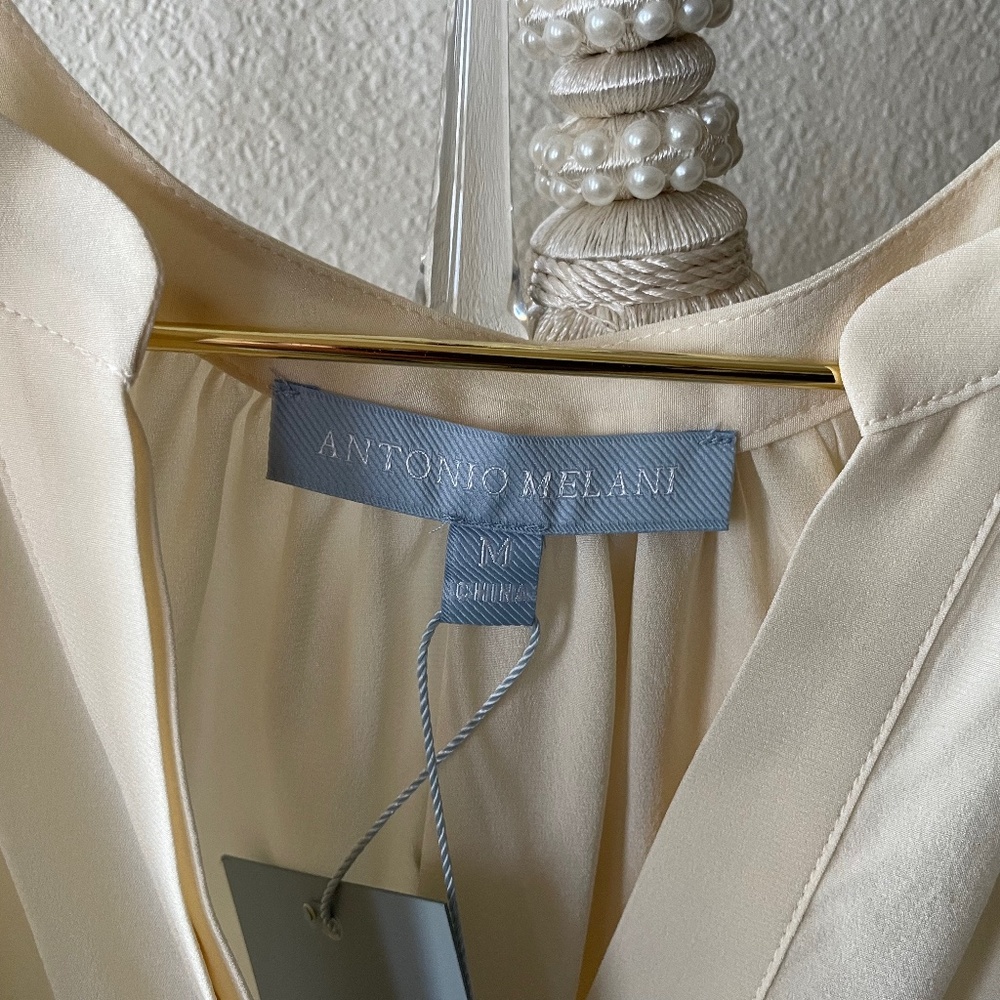 Pretty Ivory Sleeveless Blouse
